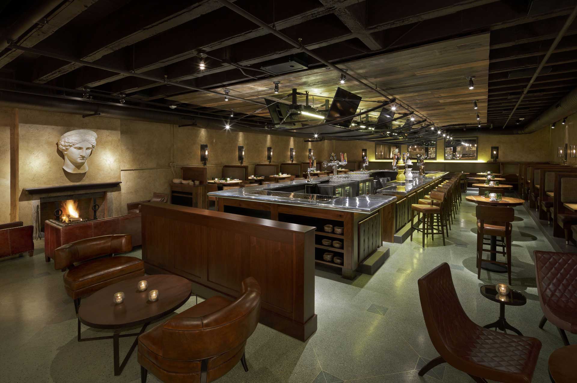 Basso features leather chairs and a cozy fireplace, creating an inviting atmosphere.