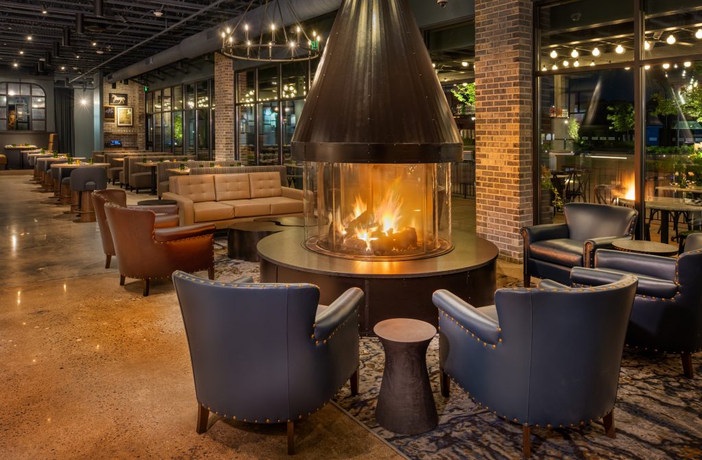 Basso on the Plaza seating with fireplace and chairs